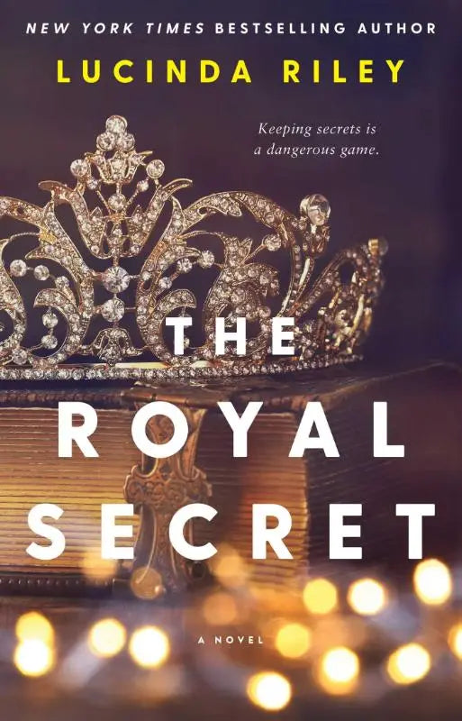 Een fonkelende gouden diadeem met diamanten op een stapel boeken voor de royal secret roman