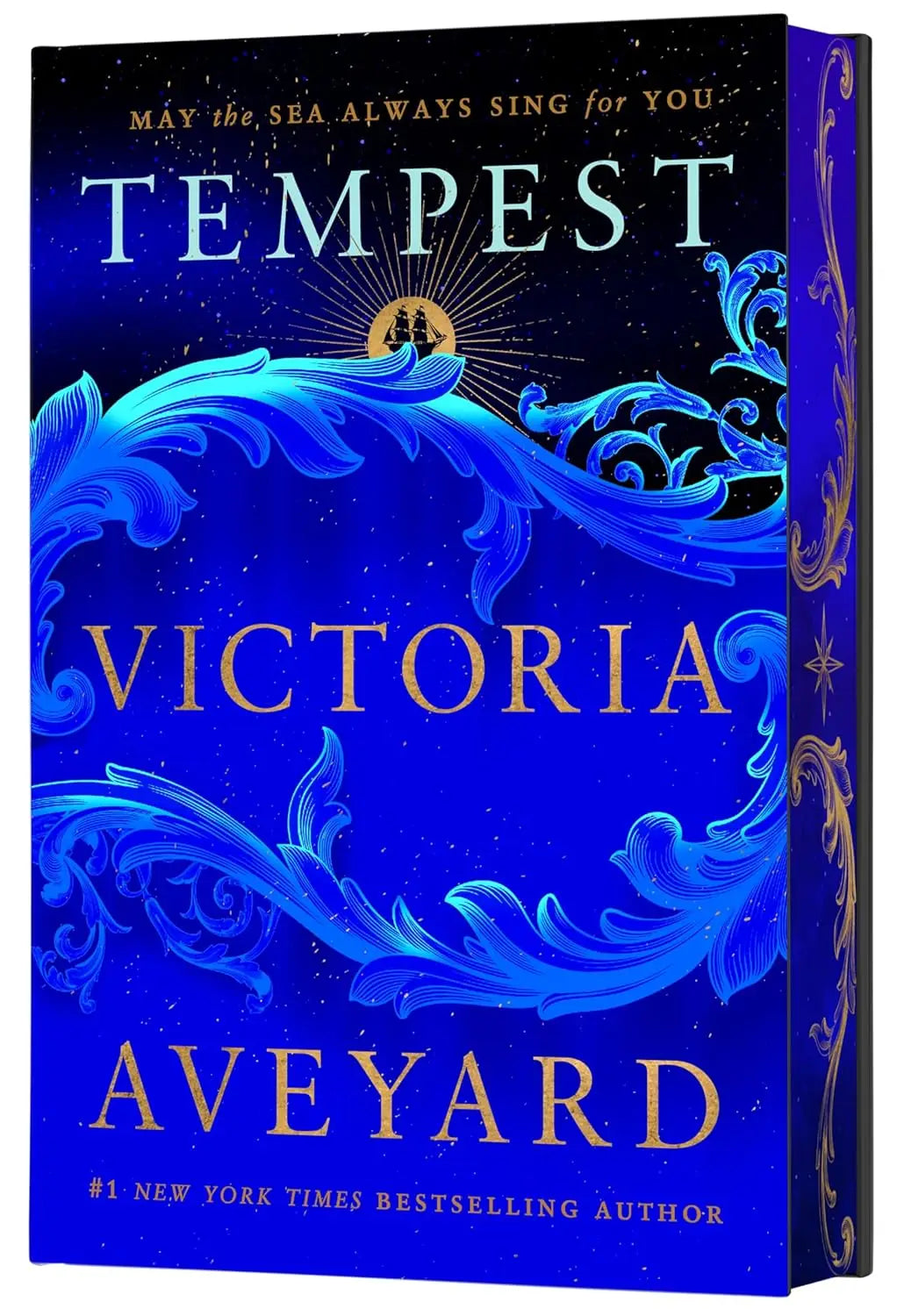 Diepblauw hardcoverboek met gouden letters en oceaandecoraties the tempest deluxe limited edition van victoria aveyard