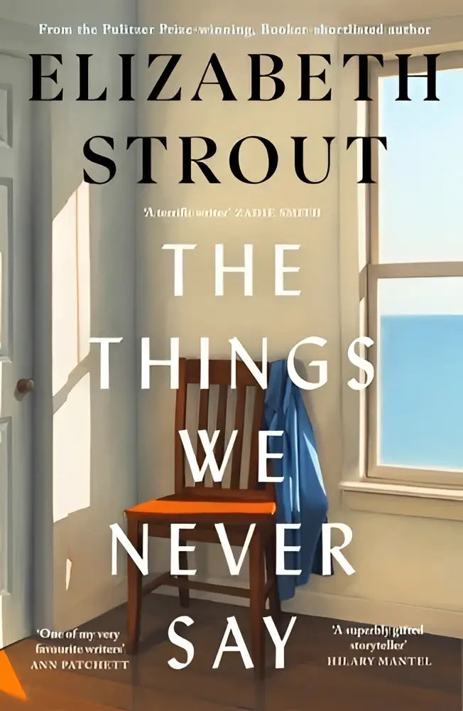 The things we never say door elizabeth strout hardcover boek met minimalistische cover houten stoel en blauw textiel