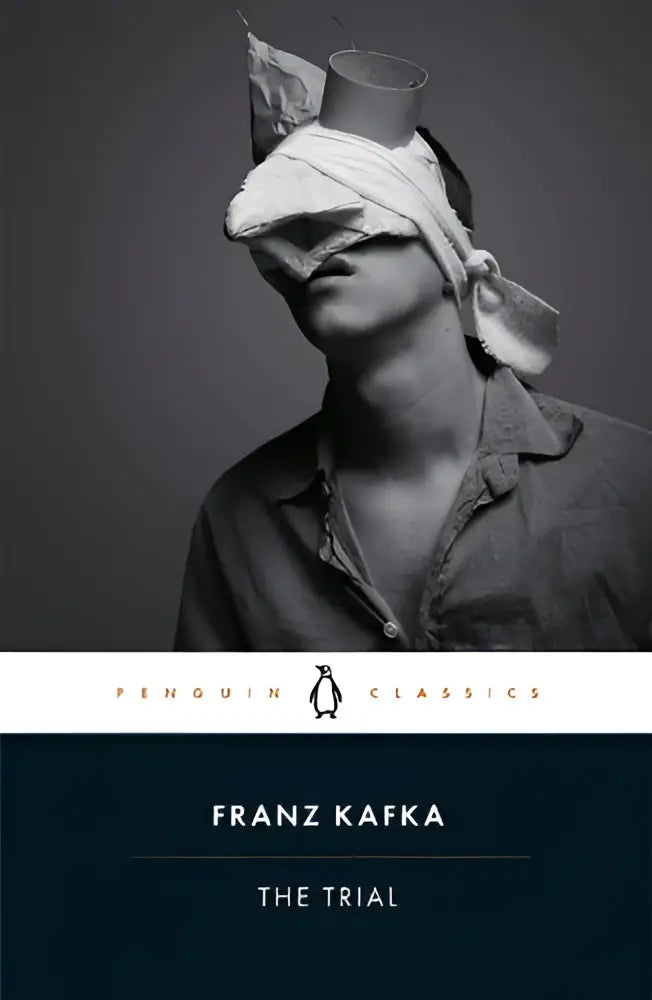 Penguin classics paperback edition of franz kafka the trial with classic yellow cover and black text