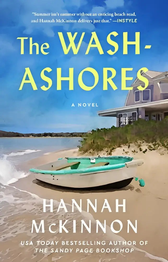 The wash-ashores a novel cover shows a teal and white rowboat on a sandy beach under a bright blue sky