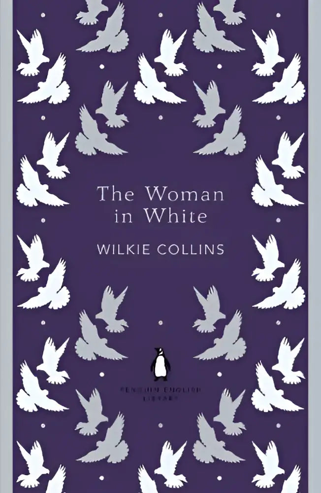 Paars hardcoverboek the woman in white van wilkie collins met witte duiven en penguin english library logo