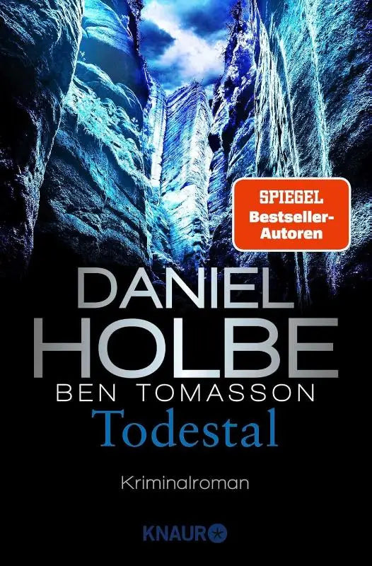 The book cover of todestal by daniel holbe features a striking blue and black canyon scene published by knaur