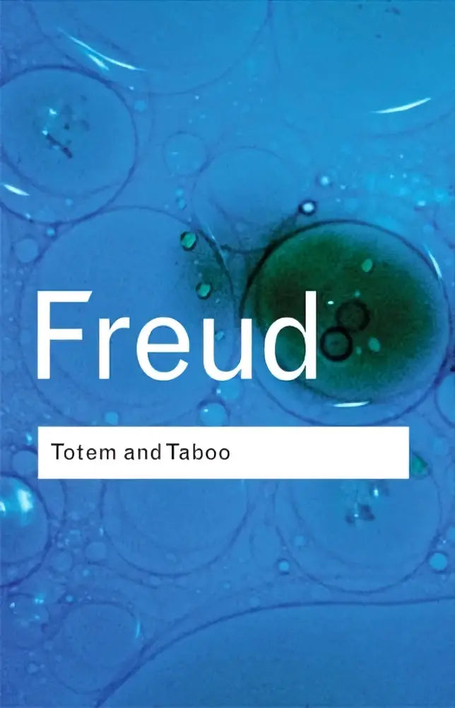 De boekomslag van totem and taboo toont de titel freud in witte letters op een abstract blauwe achtergrond met bubbelmotief