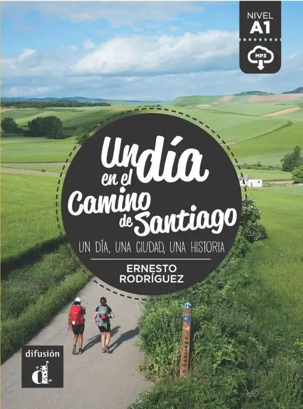 De cover van het boek un día en el camino de santiago door ernesto rodríguez toont twee wandelaars op een pad en een cirkelvormig zwart ontwerp met witte tekst in publicatie en publicaties talen algemeen binnen talen algemeen