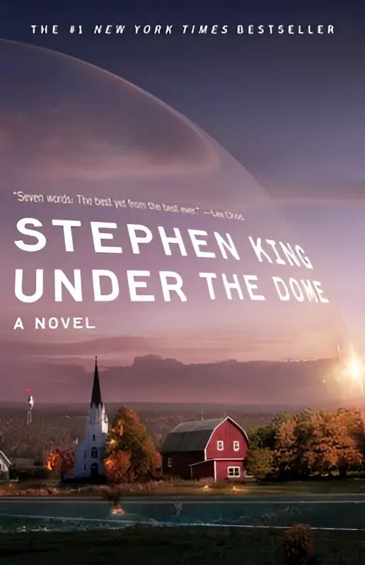 De cover van het boek under the dome van stephen king toont een levendige illustratie van een stad onder een enorme koepel