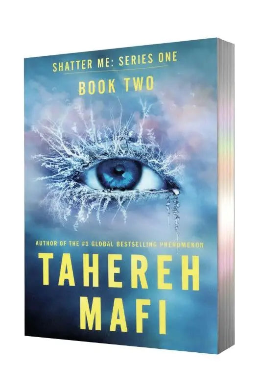Blauwe hardcover paperback deluxe limited edition van unravel me serie met vorstbedekt oog op cover door tahereh mafi