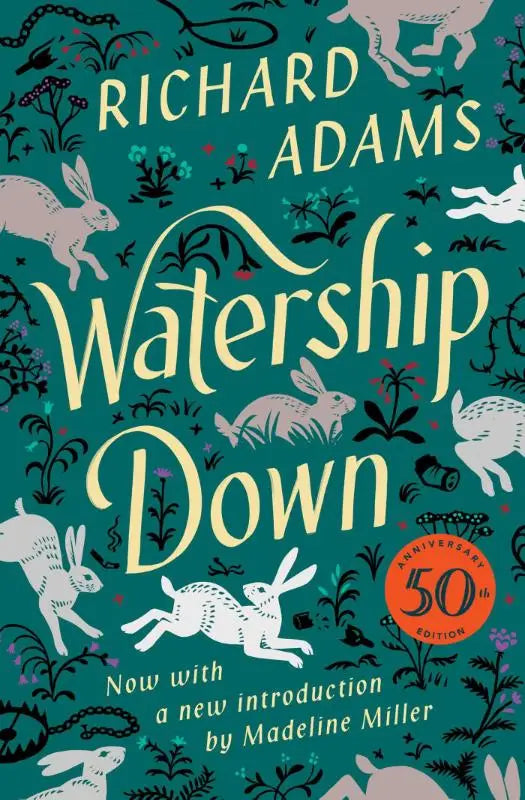 The watership down novel features a teal cover with white and pink rabbits running through foliage and an elegant title