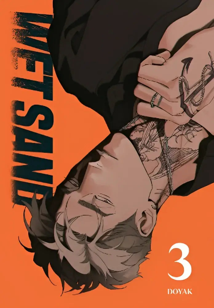 De cover van wet sand volume 3 toont een man met donker haar en zwarte inkt tatoeages op nek en armen