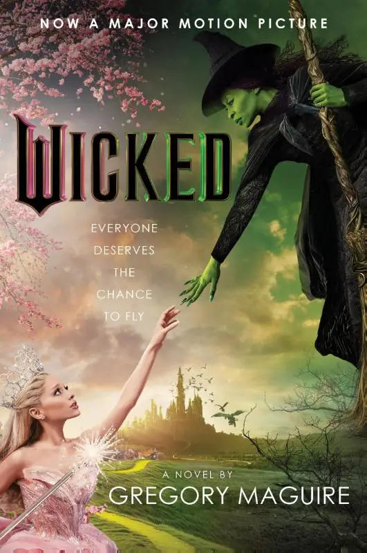 De cover van de roman wicked movie tie-in toont een groene heks en een vrouw in een roze jurk over life and times van de wicked witch