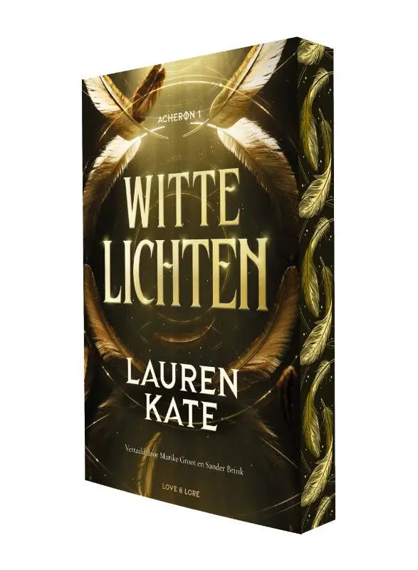 Gouden veer versierde hardcover boek witte lichten door lauren kate met elegante kaft en verfijnde afwerking