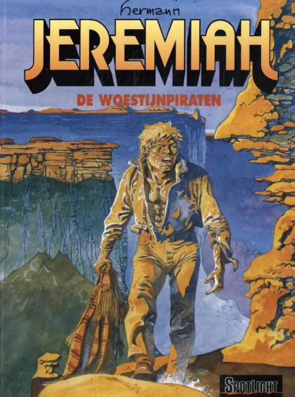 De cover van het stripboek jeremiah de woestijnpiraten met een ruige avonturier op rotsachtig terrein
