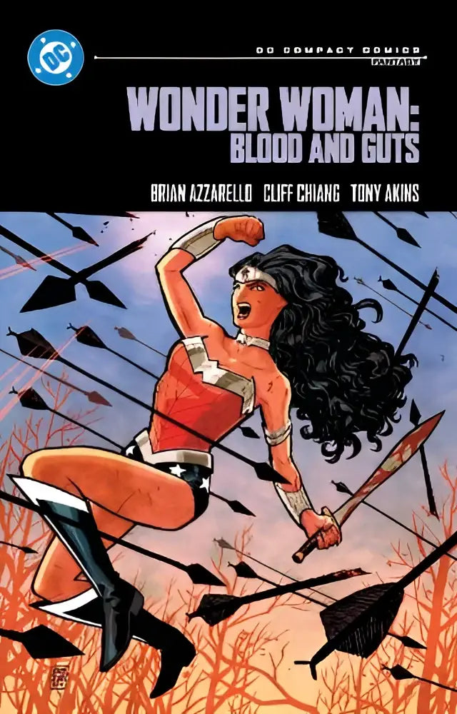 Wonder woman in red and gold costume holding a sword amid arrows on wonder woman blood and guts compact comics edition cover