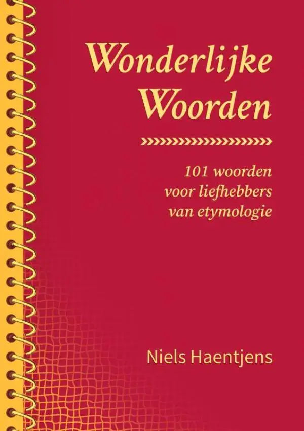 Een rode spiraalgebonden boek met gouden letters en een getextureerde omslag getiteld wonderlijke woorden van niels haentjens