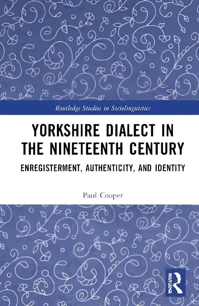 Blauw boek met witte bloemenmotieven getiteld Yorkshire dialect in the nineteenth century door Paul Cooper