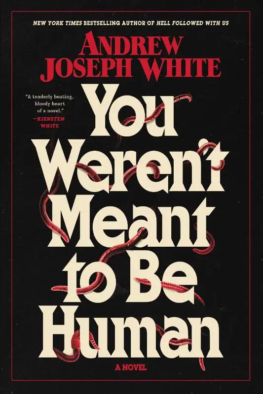 Zwarte boekomslag met crèmekleurige titel you weren’t meant to be human en rode wormachtige illustraties